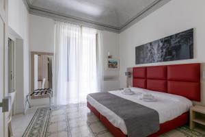 Voodi või voodid majutusasutuse Belmonte102 Esclusive Suites toas