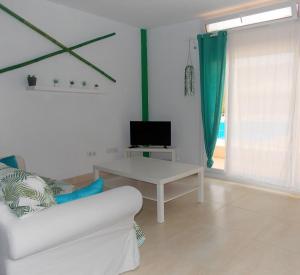TV a/nebo společenská místnost v ubytování The Green Oasis