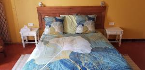 Ένα ή περισσότερα κρεβάτια σε δωμάτιο στο Les Tournesols