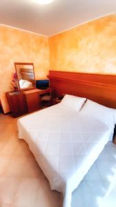 Posteľ alebo postele v izbe v ubytovaní Hotel & Wellness Fra I Pini