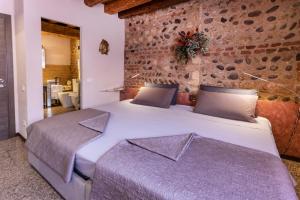 Postel nebo postele na pokoji v ubytování La Bella Verona Wine Suite