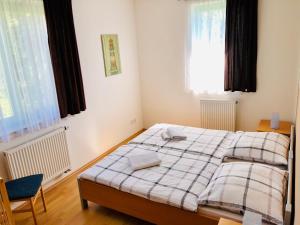 Postel nebo postele na pokoji v ubytování Apartmán Adam