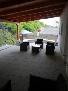 a group of benches sitting on a patio at Family Apartman in Eplény