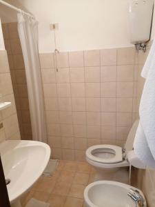 a small bathroom with a toilet and a sink at Camere da Anna Maria in Assisi