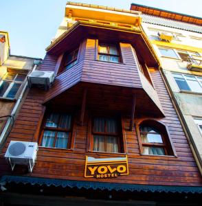 a wooden building with a yoyo hotel sign on it at yolohostel in Istanbul