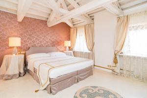 Posteľ alebo postele v izbe v ubytovaní WellVenice Fenice
