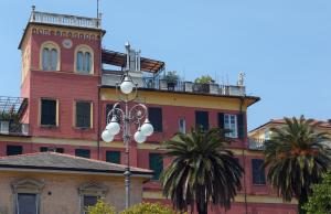a building with a street light in front of it at Hotel Palazzo Vannoni in Levanto