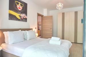 Ένα ή περισσότερα κρεβάτια σε δωμάτιο στο Fanta Sea Apartament Spa n Pool Beach resort +31 φωτογραφίες