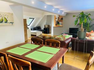 a living room with a table and a couch at Haus vom Nikolaus in Herne