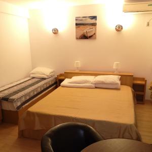 Postel nebo postele na pokoji v ubytování Vila Rocco