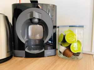 a coffee maker sitting next to a container of lemons at Camping Park Soline - Mendula I Mobile Home in Biograd na Moru