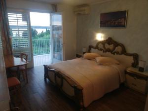 Postel nebo postele na pokoji v ubytování Guest House Vila Luka