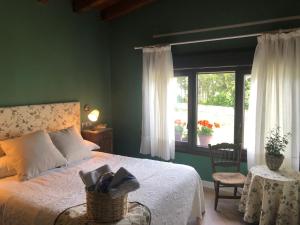 מיטה או מיטות בחדר ב-Hostal Arostegui