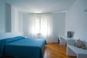 Posteľ alebo postele v izbe v ubytovaní Hotel Mistral