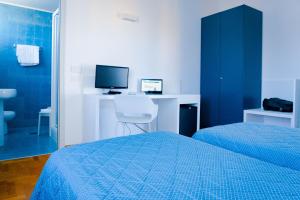 Posteľ alebo postele v izbe v ubytovaní Hotel Mistral