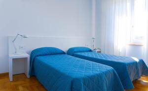 Posteľ alebo postele v izbe v ubytovaní Hotel Mistral