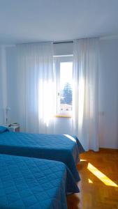 Posteľ alebo postele v izbe v ubytovaní Hotel Mistral