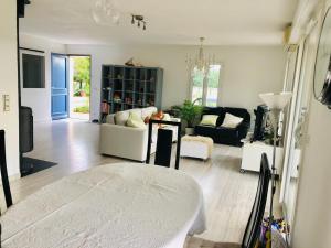 a living room with a couch and a table at madame LI in Cogolin