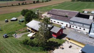 an aerial view of a farm with a red building at Ferienhaus Tannenhof in Birgel