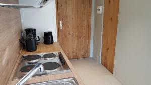 a kitchen with a sink and a counter top at Achillea Alpina Cervinia apartment Vda Vacanze in Vetta CIR 0249 in Breuil-Cervinia