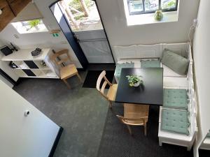 an overhead view of a living room with a table and chairs at B&B De Lage Zwaluw in Lage Zwaluwe