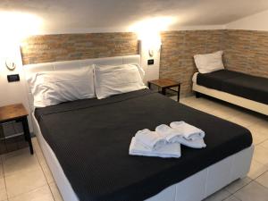 Posteľ alebo postele v izbe v ubytovaní B&B Il Viaggiatore