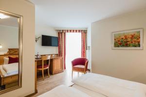 En eller flere senger på et rom på Hotel Bayrischer Löwe