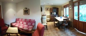 a living room with a couch and a table at Ático-Duplex Basa la Mora in Saravillo