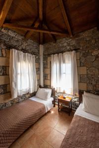 Postel nebo postele na pokoji v ubytování Myrto Villas