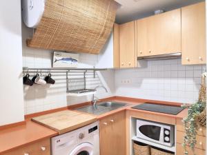 Kuchyňa alebo kuchynka v ubytovaní Apartaments la Rambla - L'Arrel - 4 persones