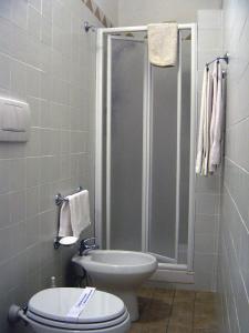 a bathroom with a shower with a toilet and a shower at Casa Gori in Certaldo