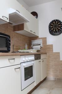 Kuchyň nebo kuchyňský kout v ubytování Villa Toscana