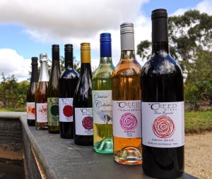 a number of bottles of wine on a table at Lyndoch Hill in Lyndoch