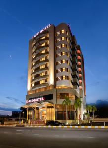 a hotel building with a sign on top of it at E-RED HOTEL KUANTAN in Kuantan