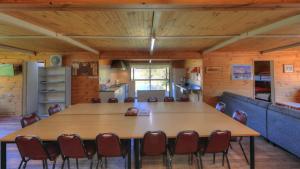 a conference room with a large table and chairs at Anglers Reach Lakeside Village in Anglers Reach