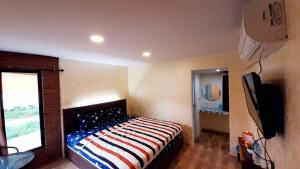 Krevet ili kreveti u jedinici u okviru objekta Rapeepat Residential and Resort
