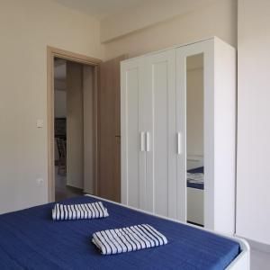 Postel nebo postele na pokoji v ubytování Lagonisi Apartment