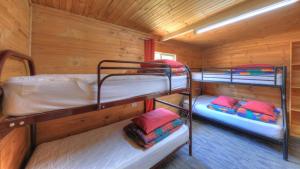two bunk beds in a small room at Anglers Reach Lakeside Village in Anglers Reach