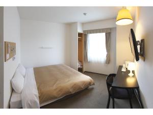 Letto o letti in una camera di Hotel Crown Hills Toyohashi