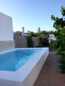 a swimming pool in a backyard with at Casa Baraka in Algodonales