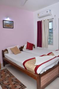 Lova arba lovos apgyvendinimo įstaigoje Satiya Guest House