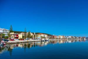 a large body of water with buildings and a city at A & B Minimal Suite with Sea View in Argostoli in Argostoli