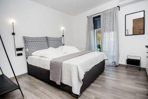 Posteľ alebo postele v izbe v ubytovaní A & B Minimal Suite with Sea View in Argostoli