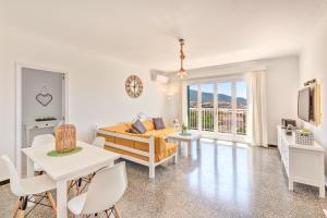 a living room with a couch and a table at Hermanas Femenias in Calvia Town