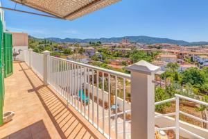 a balcony with a view of a city at Hermanas Femenias in Calvia Town