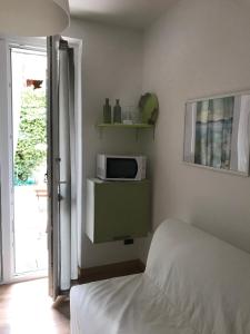 Postel nebo postele na pokoji v ubytování Green Corner Gelsomino