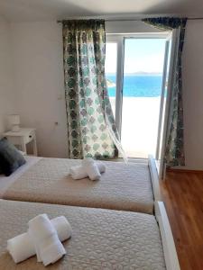 Postel nebo postele na pokoji v ubytování Apartman Šime
