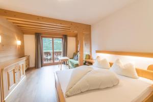 Postel nebo postele na pokoji v ubytování Pension Apartments Pardell