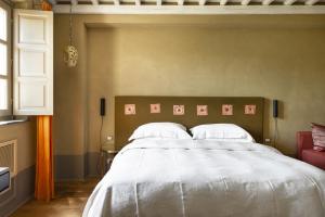 Tempat tidur dalam kamar di Locanda al Colle