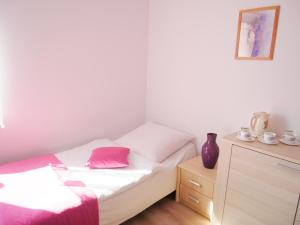 Łóżko lub łóżka w pokoju w obiekcie Słoneczny Dom pokoje i apartament na wynajem